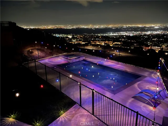 a view of residential houses with a yard and mountain