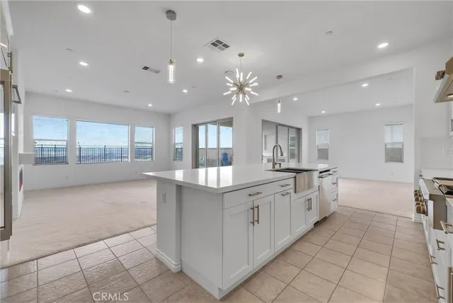 a view of a hallway with closet and bathroom