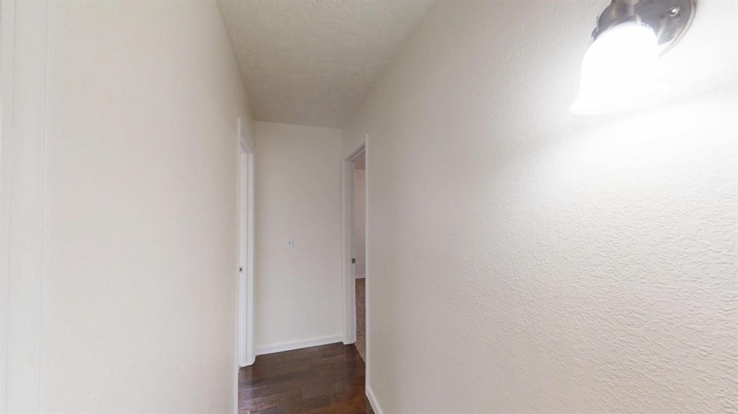495 Pacific Street Coalinga, CA 93210 - Photo 17 of 33 a view of a hallway
