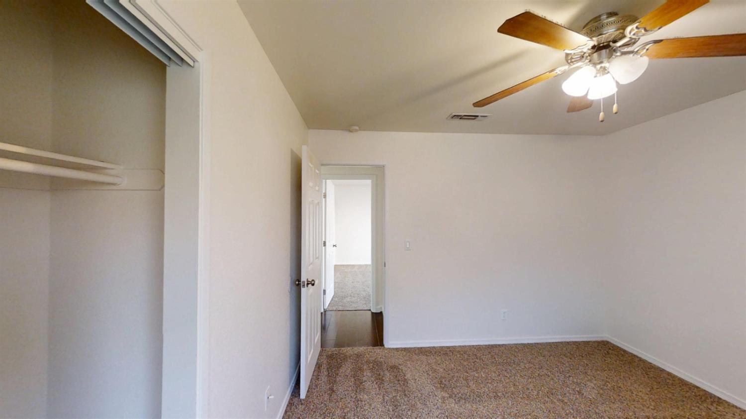 495 Pacific Street Coalinga, CA 93210 - Photo 20 of 33 a view of room with a ceiling fan
