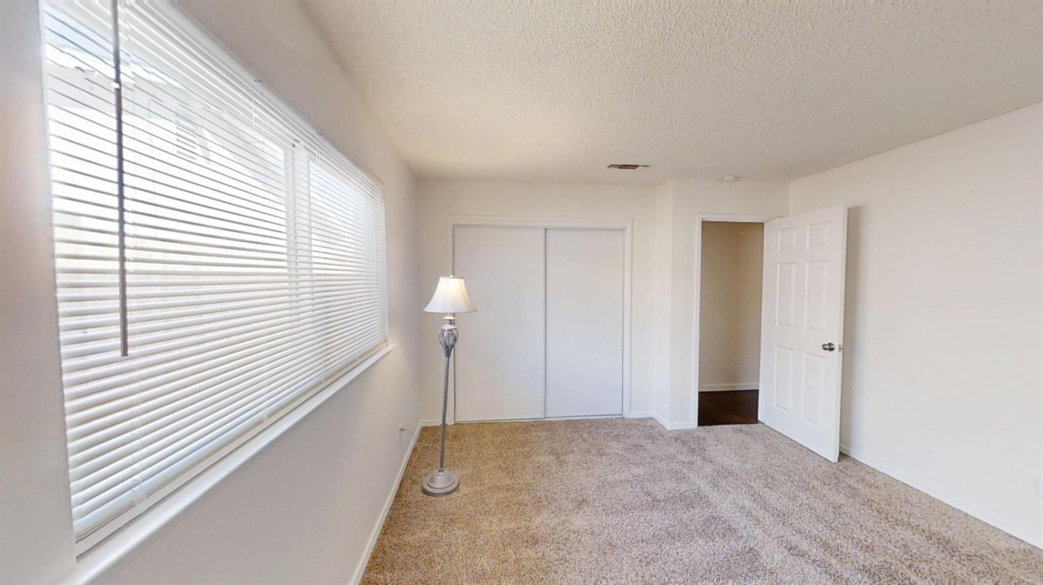 495 Pacific Street Coalinga, CA 93210 - Photo 22 of 33 a view of a room with a staircase