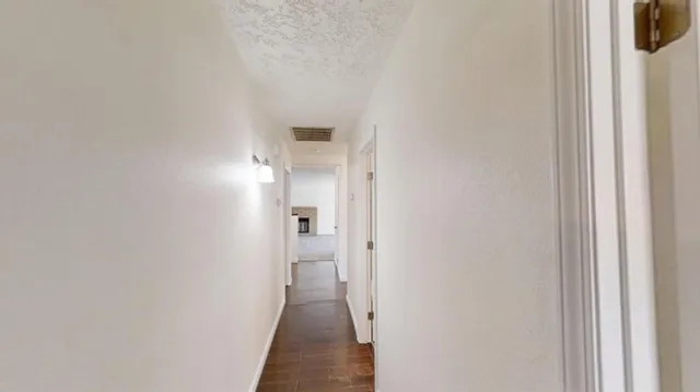 a view of a bathroom from a hallway