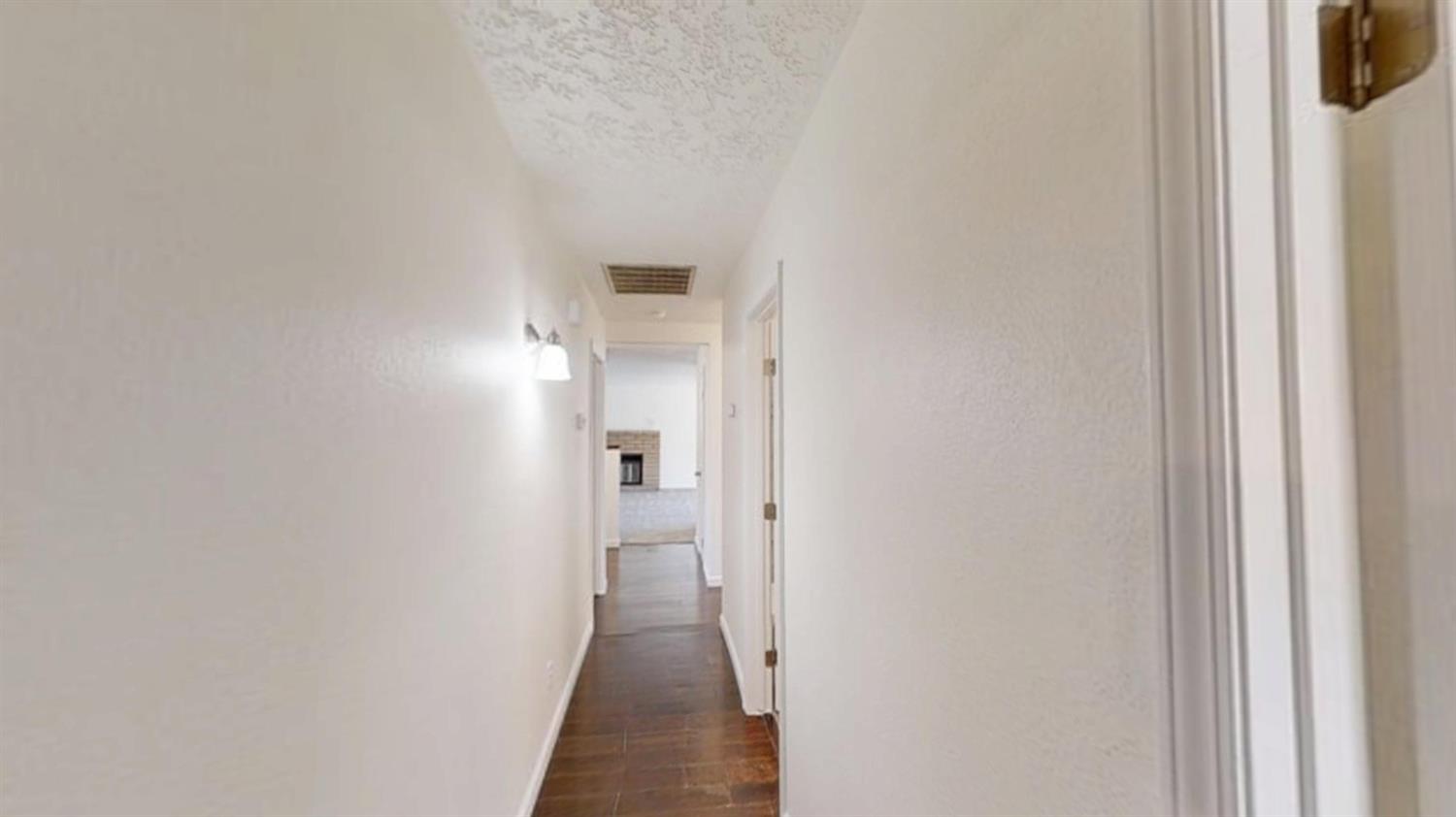 495 Pacific Street Coalinga, CA 93210 - Photo 25 of 33 a view of a bathroom from a hallway