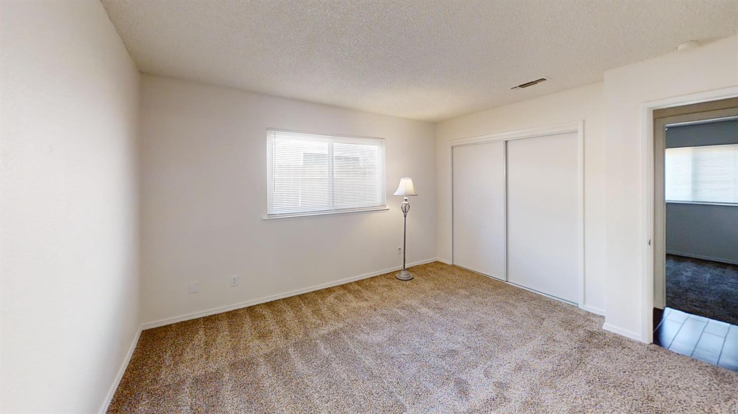 495 Pacific Street Coalinga, CA 93210 - Photo 28 of 33 an empty room with windows