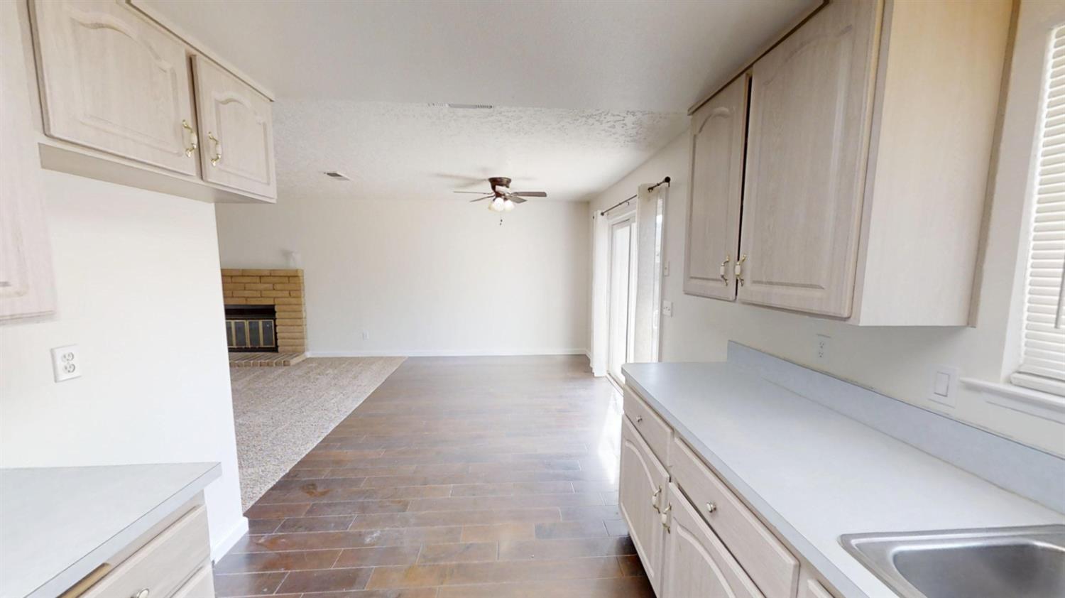 495 Pacific Street Coalinga, CA 93210 - Photo 8 of 33 a view of a kitchen from the hallway