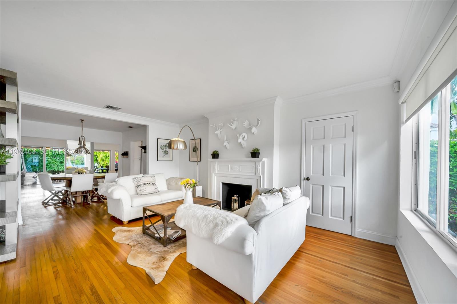 540 Southwest 27th Road Miami, FL 33129 - Photo 12 of 54 a living room with furniture fireplace and a large window