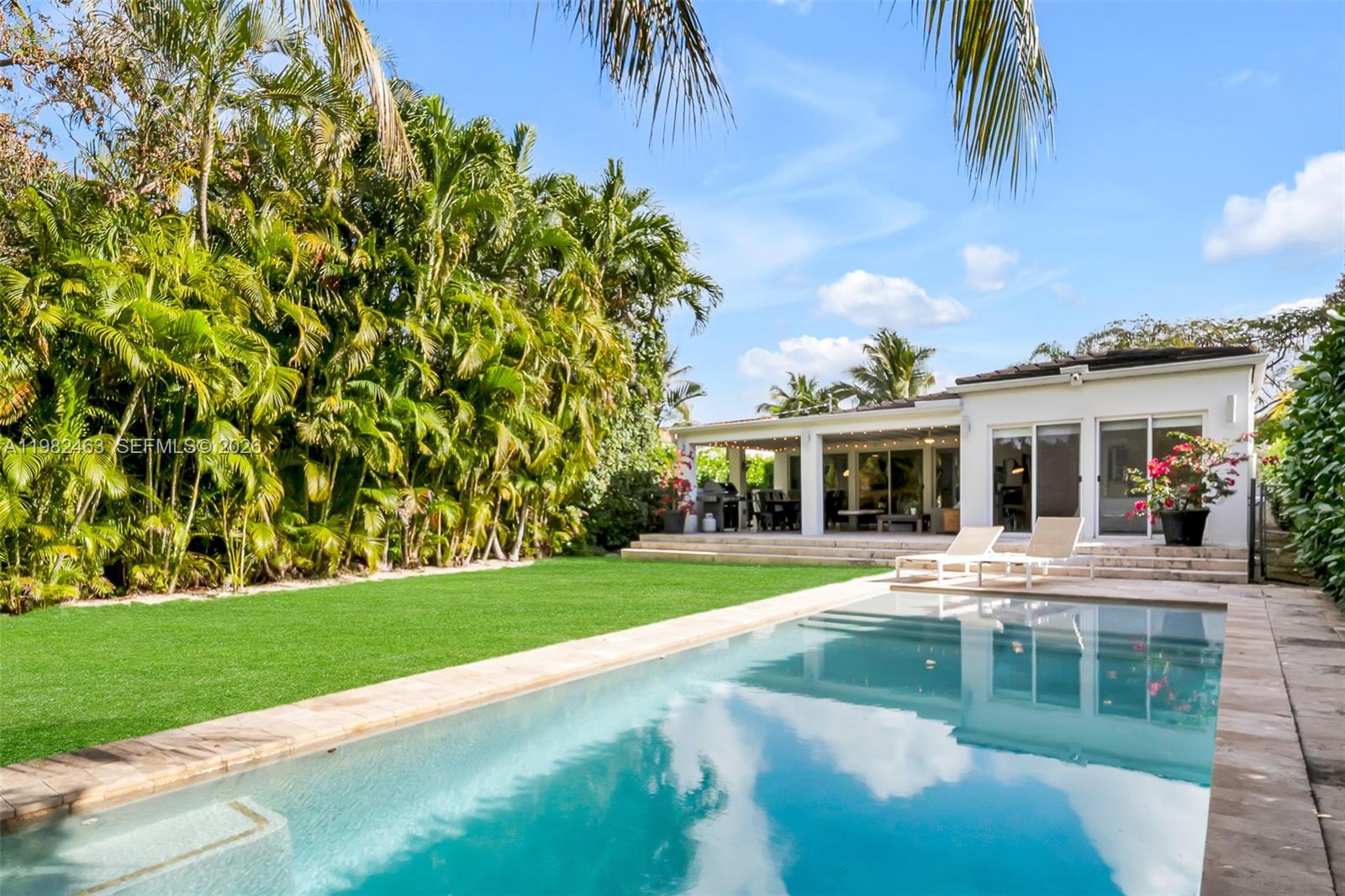 540 Southwest 27th Road Miami, FL 33129 - Photo 2 of 54 a front view of a house with a yard table and chairs