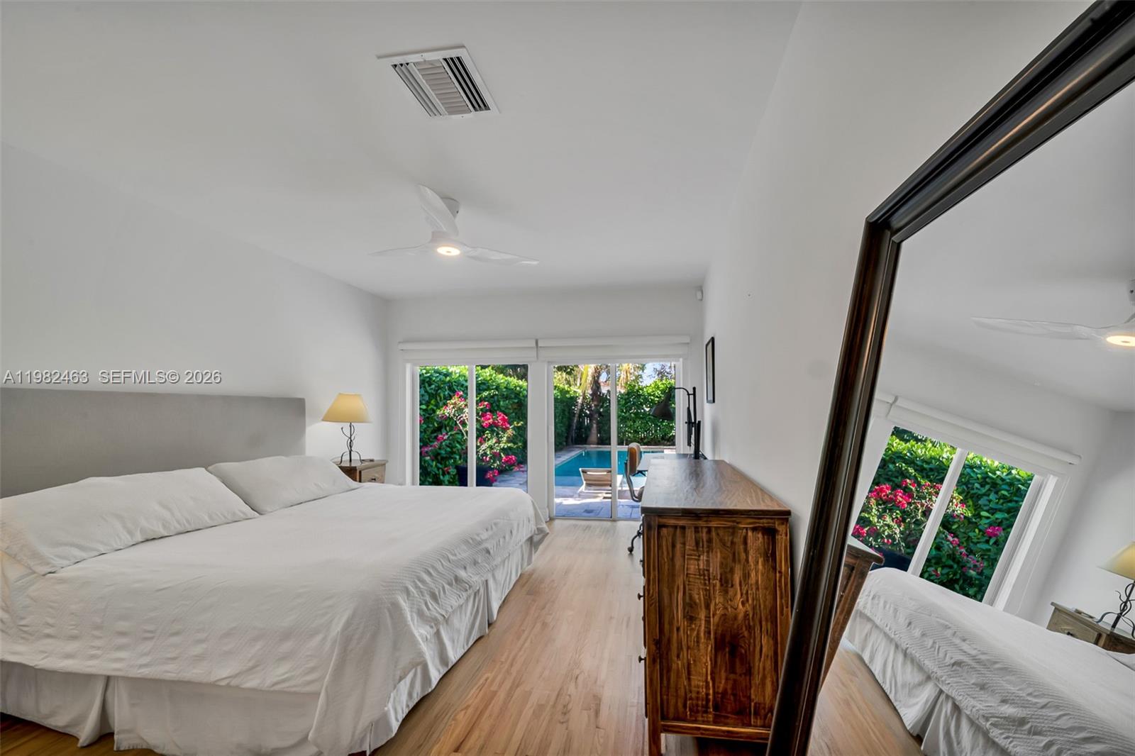 540 Southwest 27th Road Miami, FL 33129 - Photo 24 of 54 a bedroom with a bed and large windows