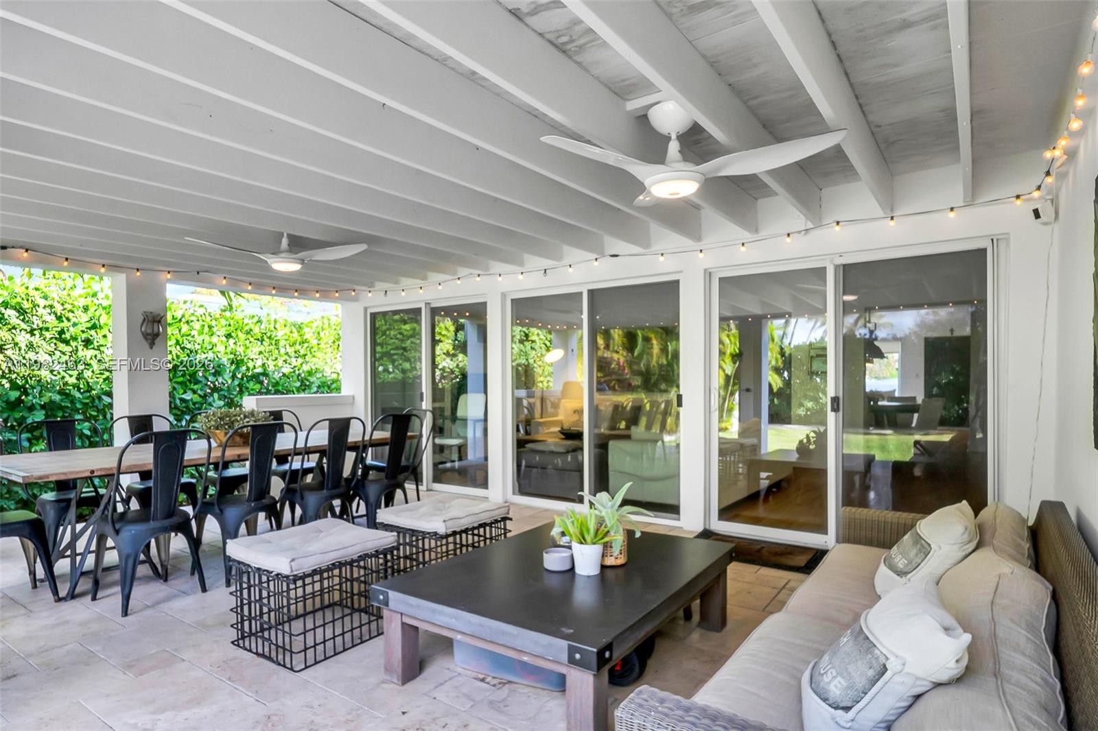 540 Southwest 27th Road Miami, FL 33129 - Photo 33 of 54 a living room with furniture and floor to ceiling windows
