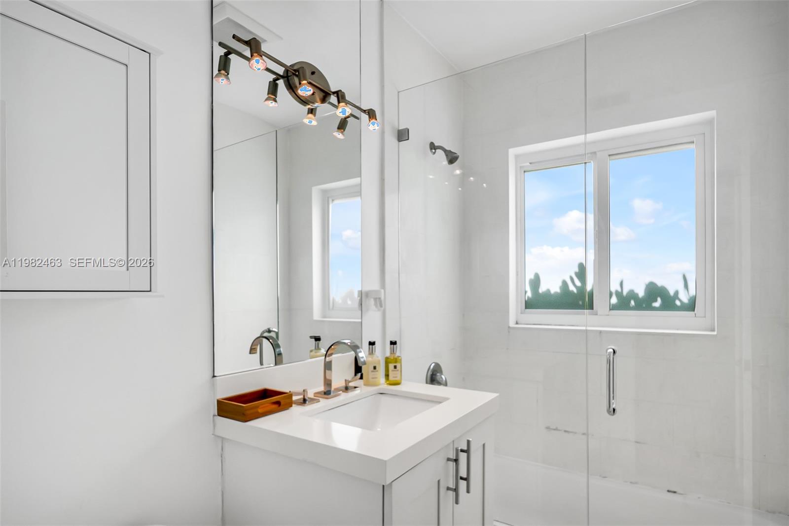 540 Southwest 27th Road Miami, FL 33129 - Photo 41 of 54 a bathroom with a sink and a window