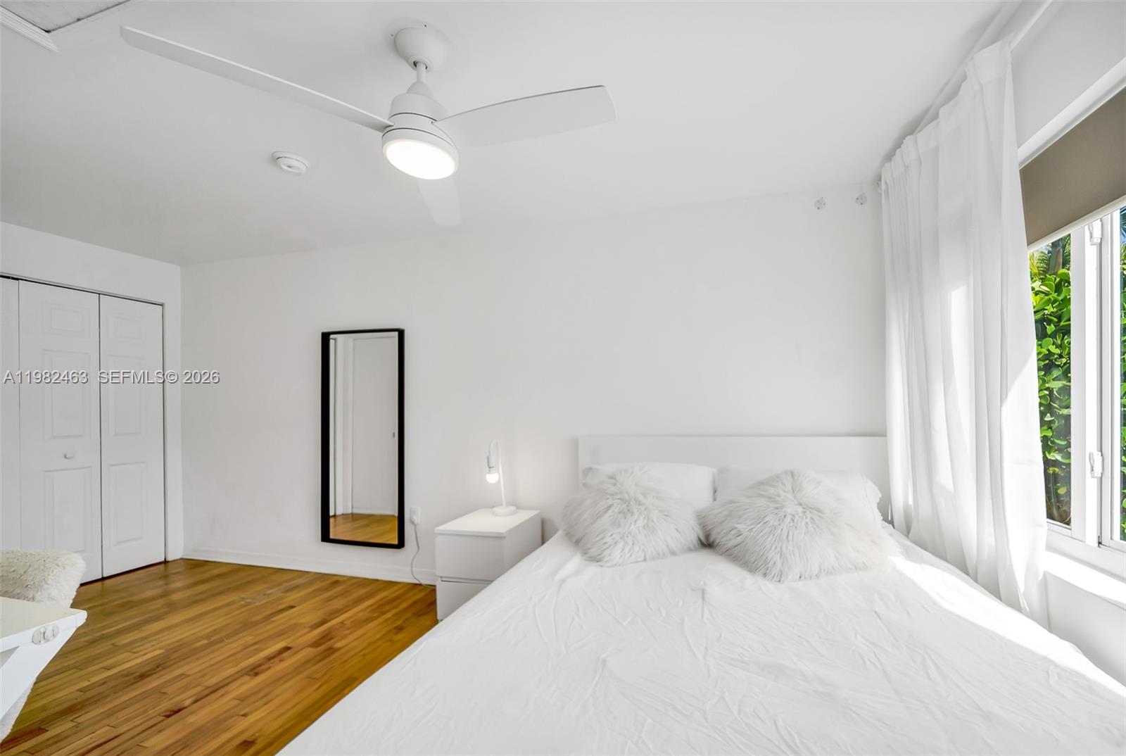 540 Southwest 27th Road Miami, FL 33129 - Photo 42 of 54 a bedroom with a bed and a large window