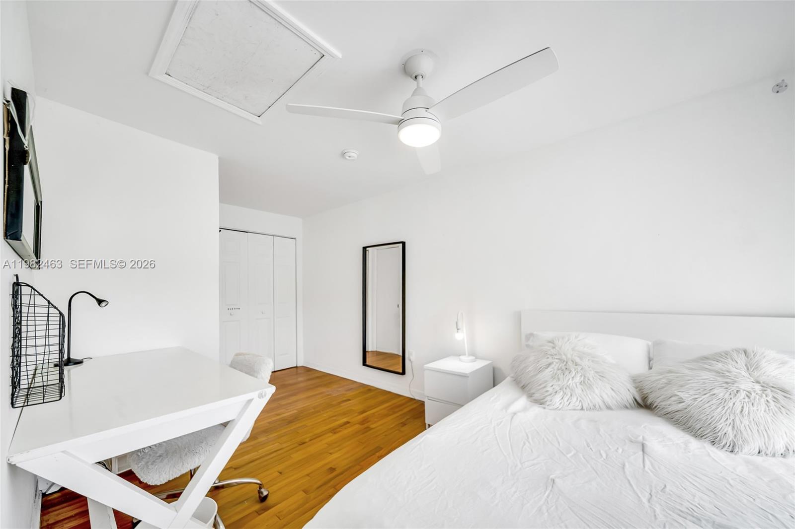 540 Southwest 27th Road Miami, FL 33129 - Photo 45 of 54 a bedroom with a bed and a desk