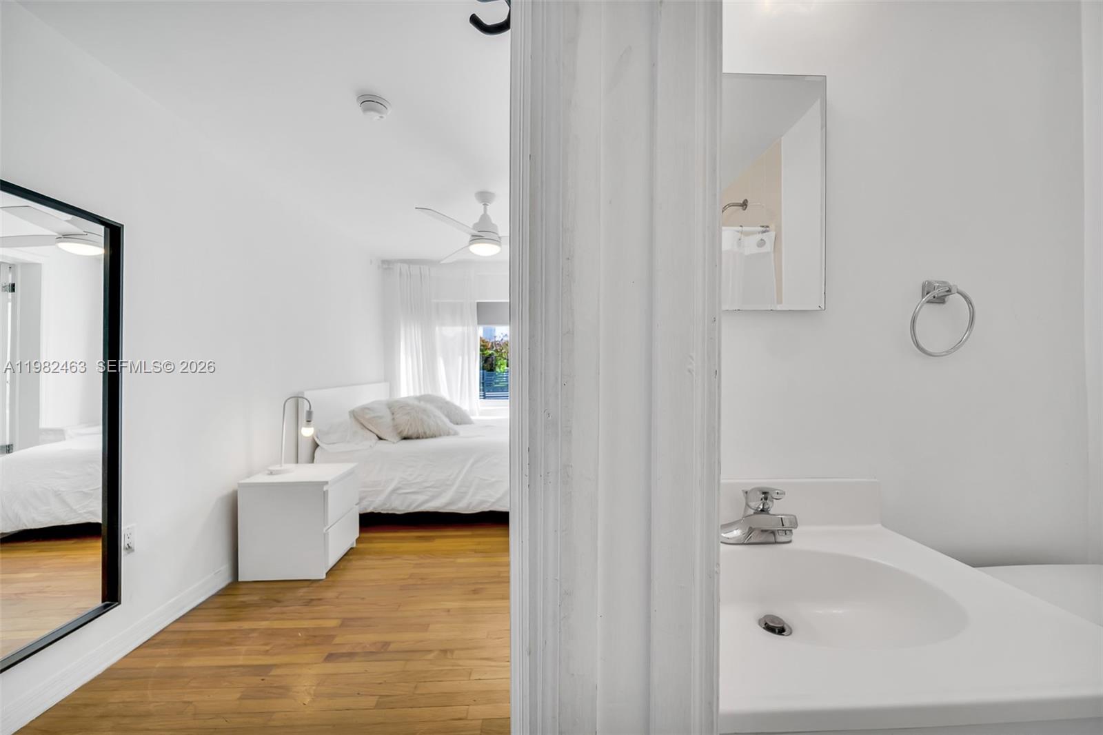 540 Southwest 27th Road Miami, FL 33129 - Photo 46 of 54 a en suite bathroom with a sink and mirror