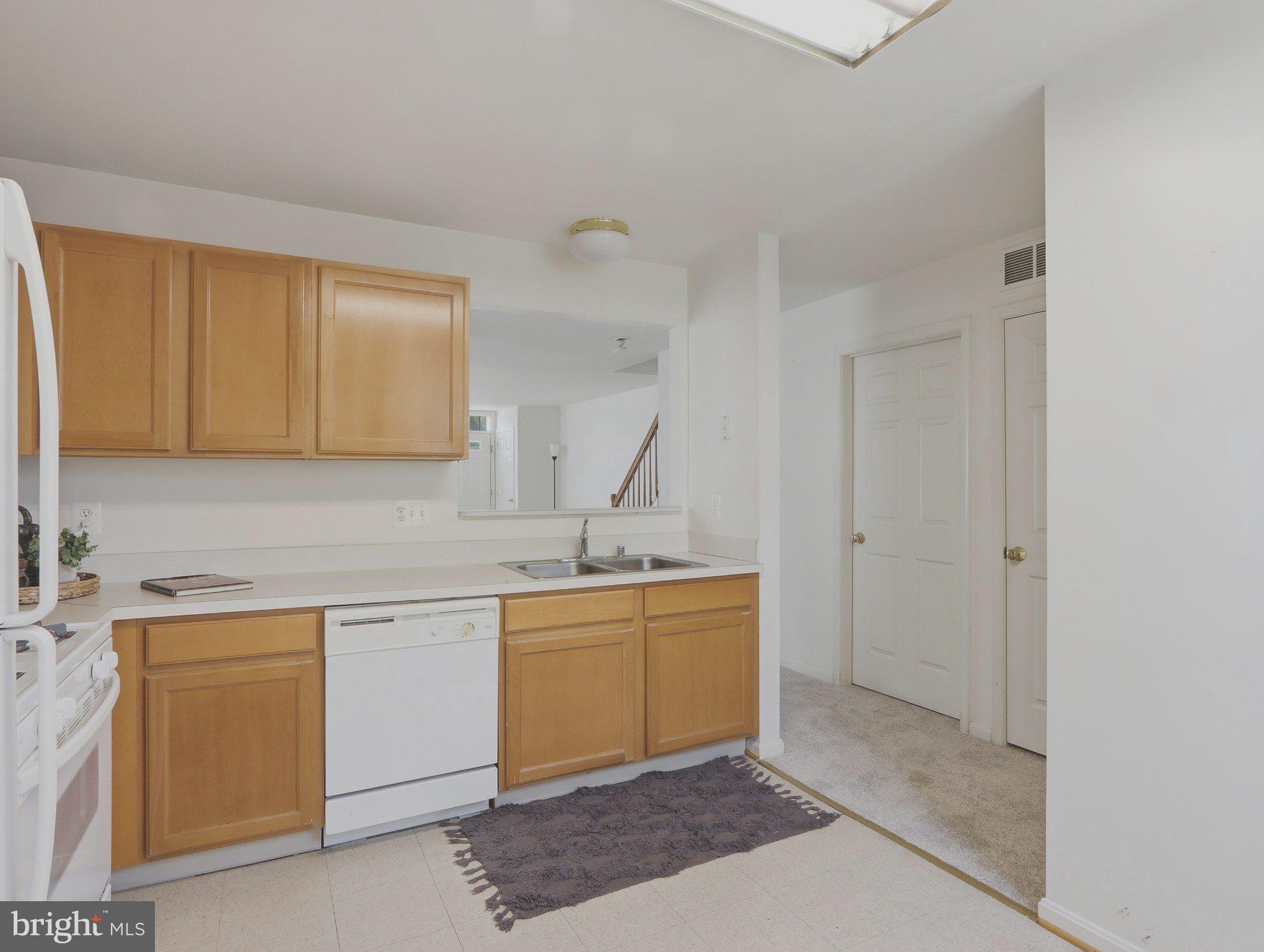 907 Myrtle Avenue Baltimore, MD 21201 - Photo 16 of 28 a kitchen with a sink and cabinets