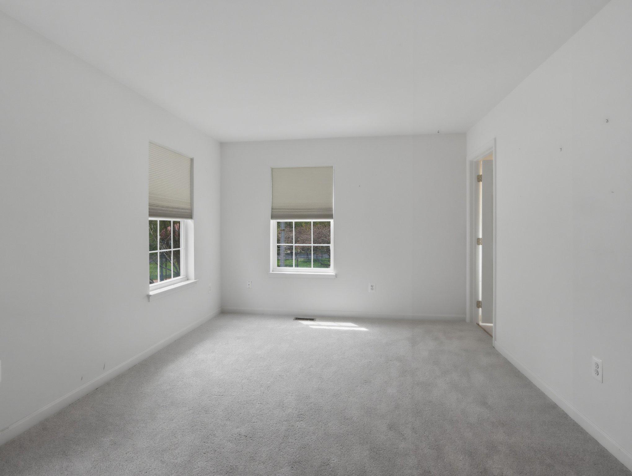 907 Myrtle Avenue Baltimore, MD 21201 - Photo 23 of 28 an empty room with windows
