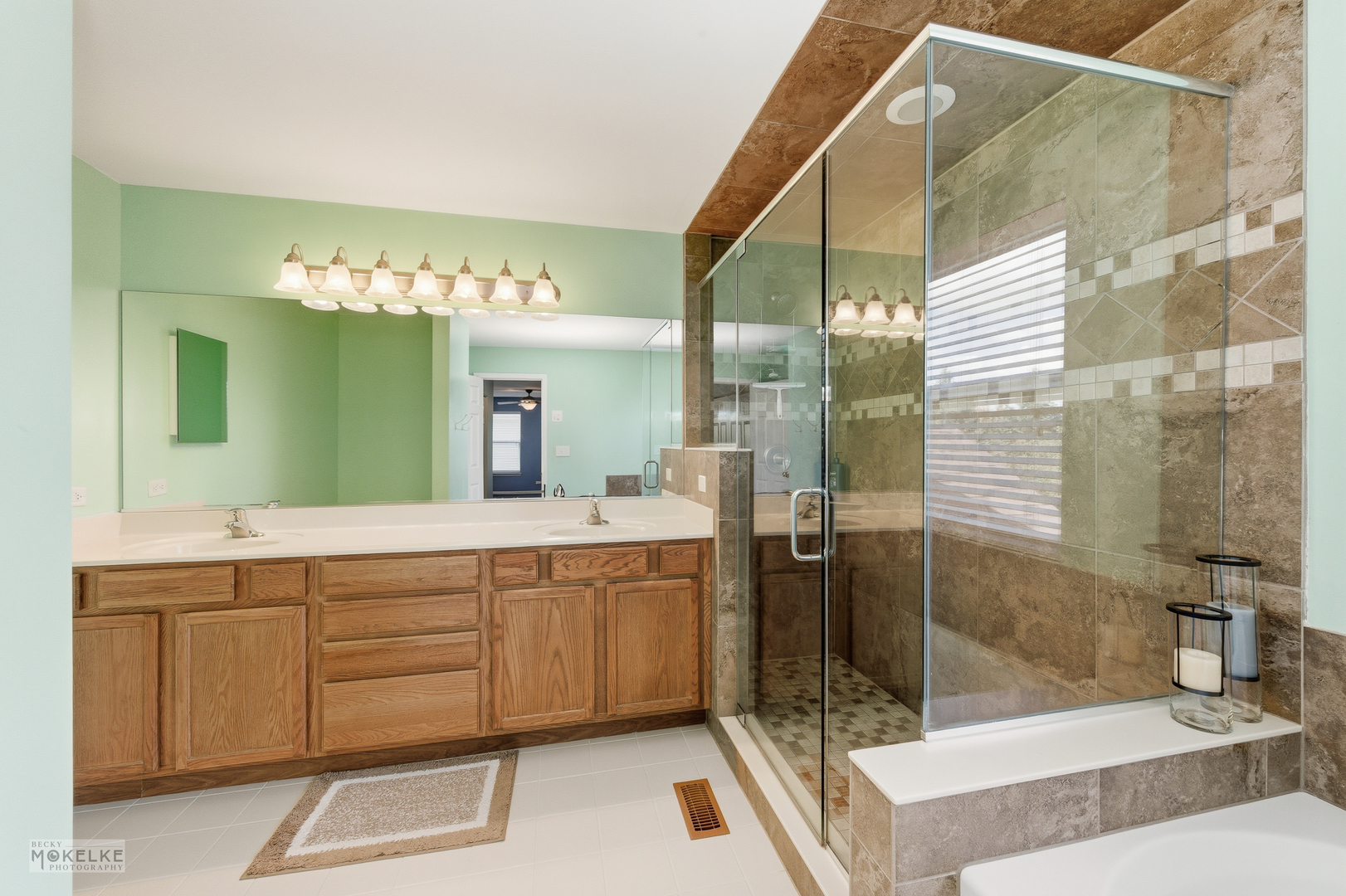 621 Mansfield Way Oswego, IL 60543 - Photo 17 of 37 a spacious bathroom with a glass shower sink and mirror