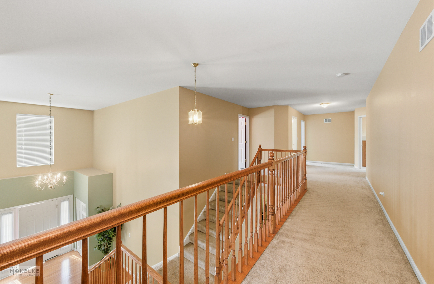 621 Mansfield Way Oswego, IL 60543 - Photo 19 of 37 a view of a hallway with wooden floor