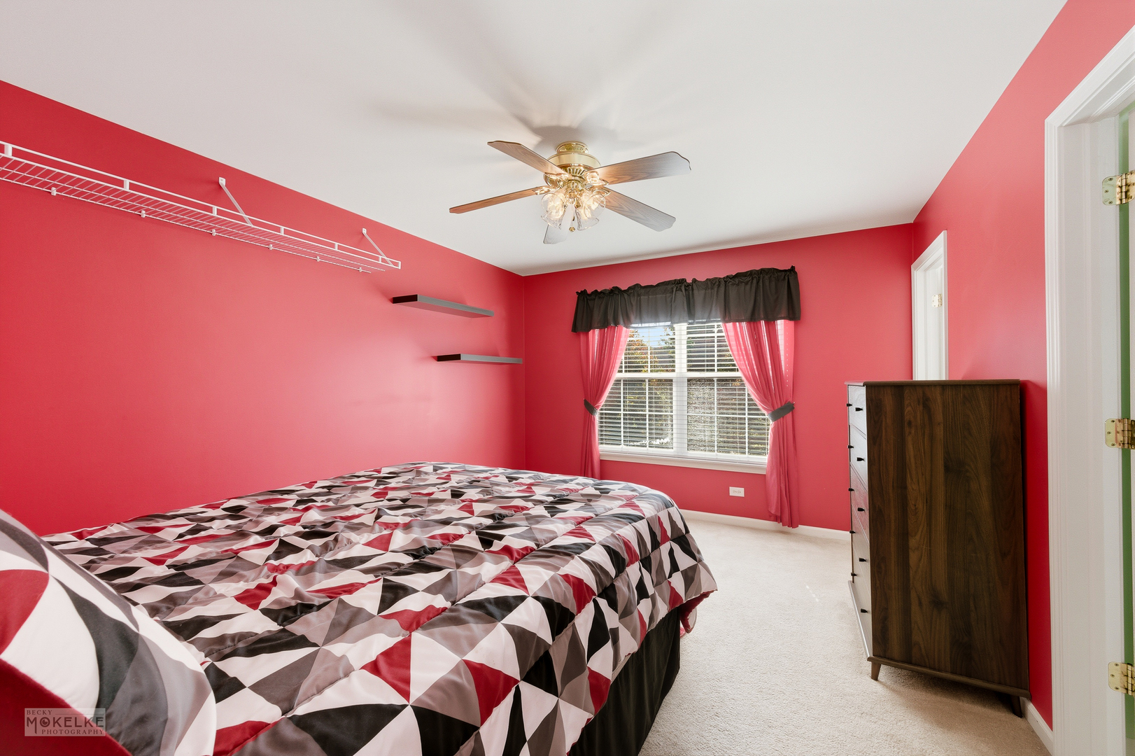 621 Mansfield Way Oswego, IL 60543 - Photo 20 of 37 a bedroom with a bed and a chandelier