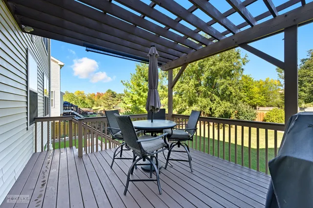 a view of a two chairs in the balcony