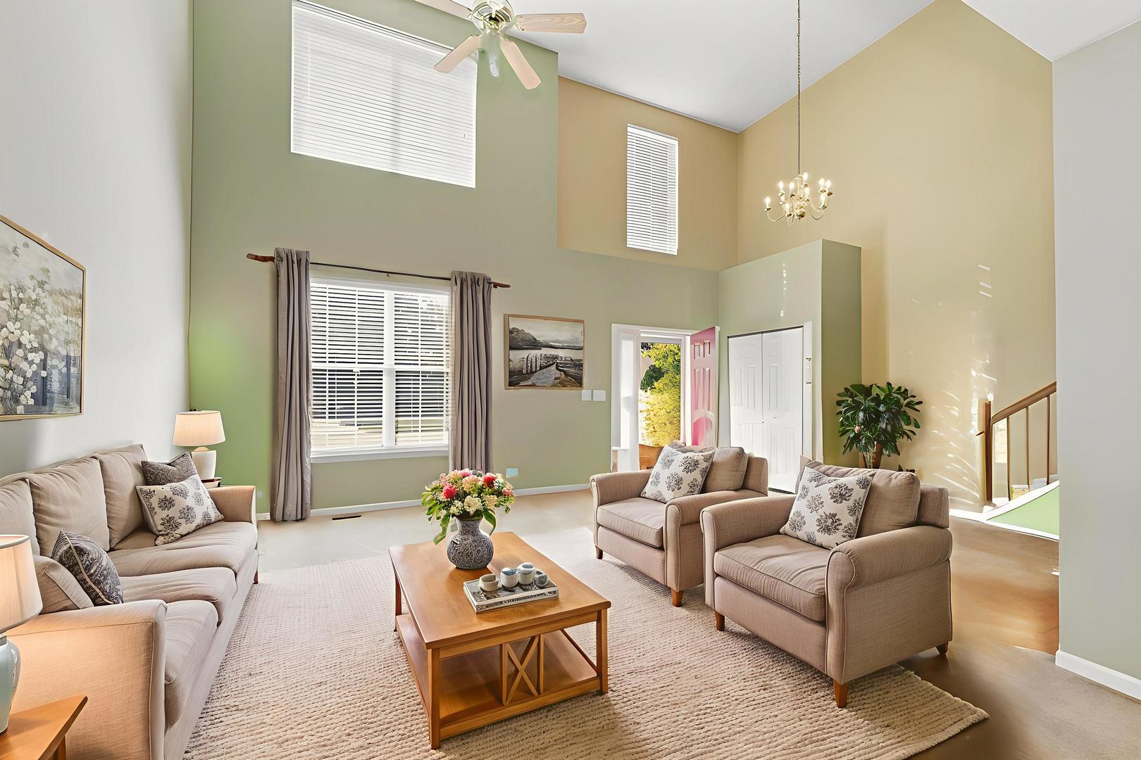 621 Mansfield Way Oswego, IL 60543 - Photo 3 of 37 a living room with furniture and a large window