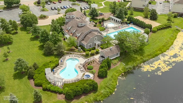 an aerial view of a house with a swimming pool