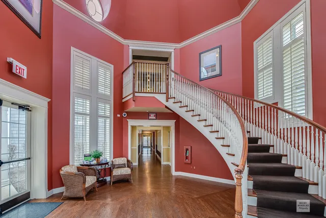 a balcony with couch and wooden floor