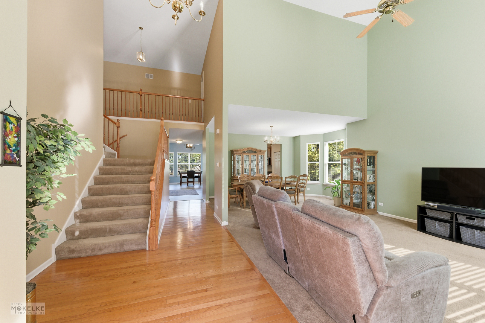 621 Mansfield Way Oswego, IL 60543 - Photo 4 of 37 a living room with furniture and a flat screen tv