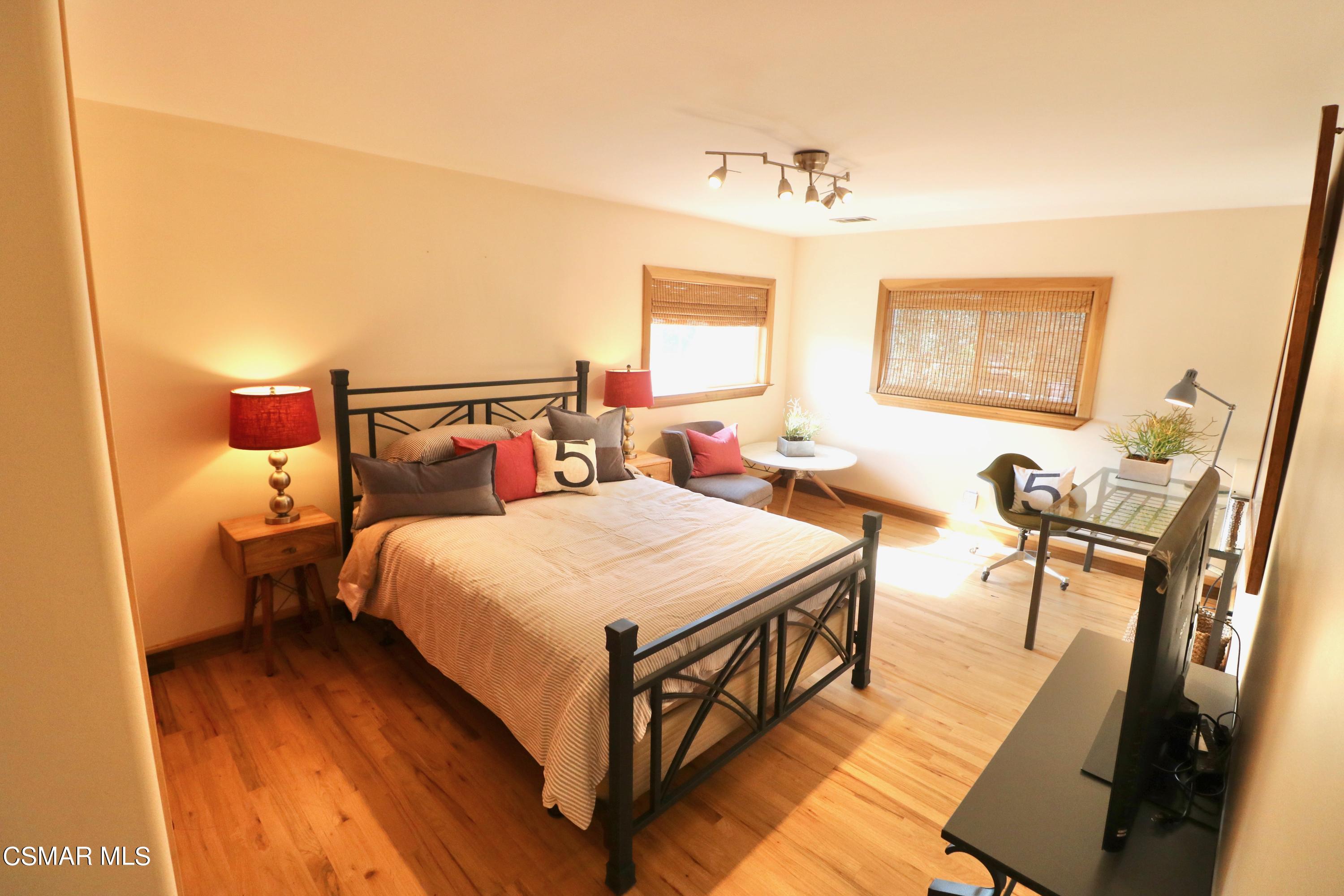 4608 Apricot Road Simi Valley, CA 93063 - Photo 18 of 37 a bedroom with a bed and wooden floor