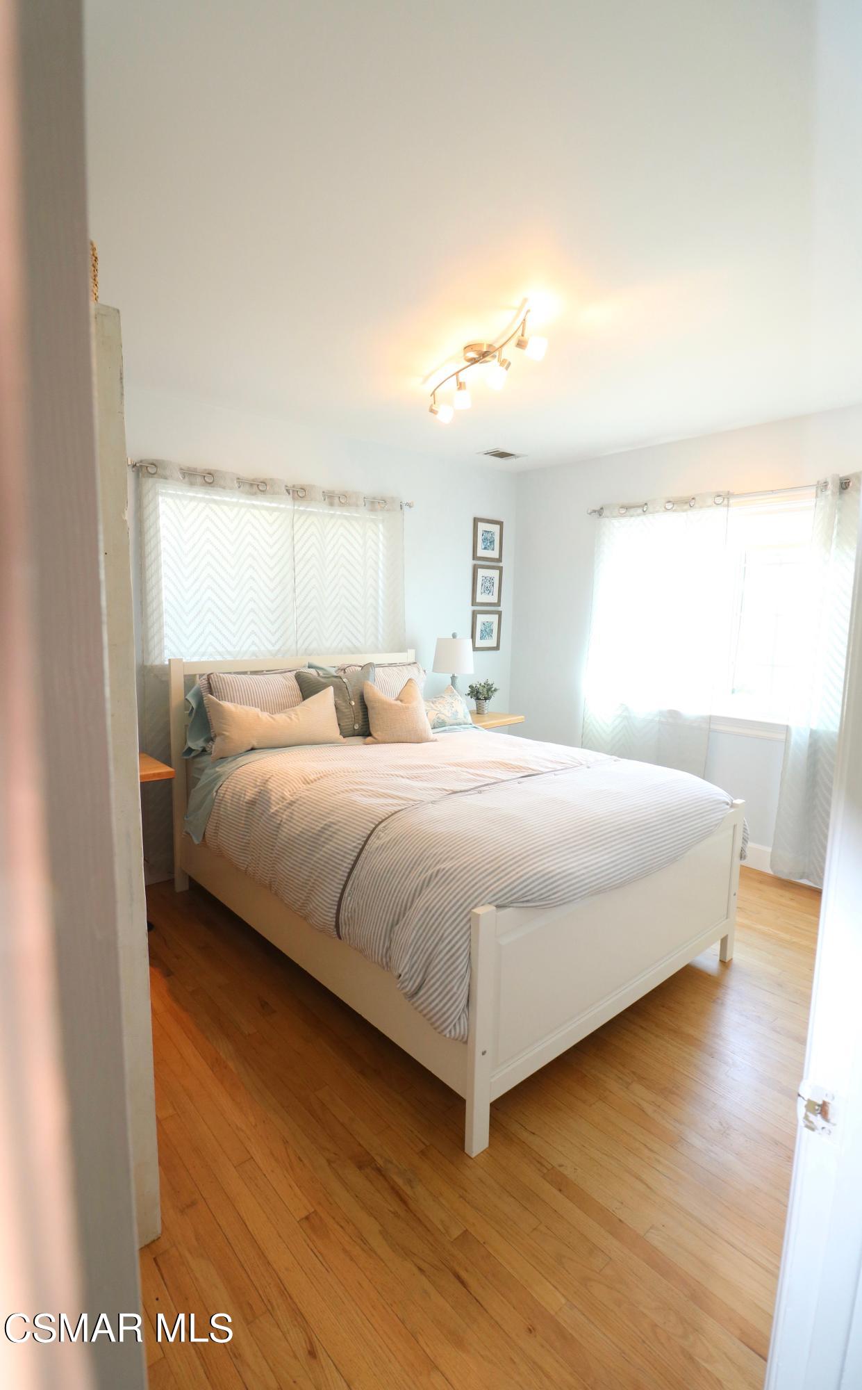 4608 Apricot Road Simi Valley, CA 93063 - Photo 19 of 37 a bedroom with a bed and a night stand