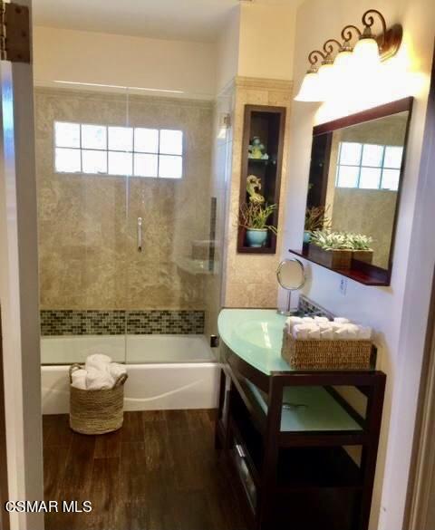4608 Apricot Road Simi Valley, CA 93063 - Photo 25 of 37 a bathroom with a tub sink and mirror