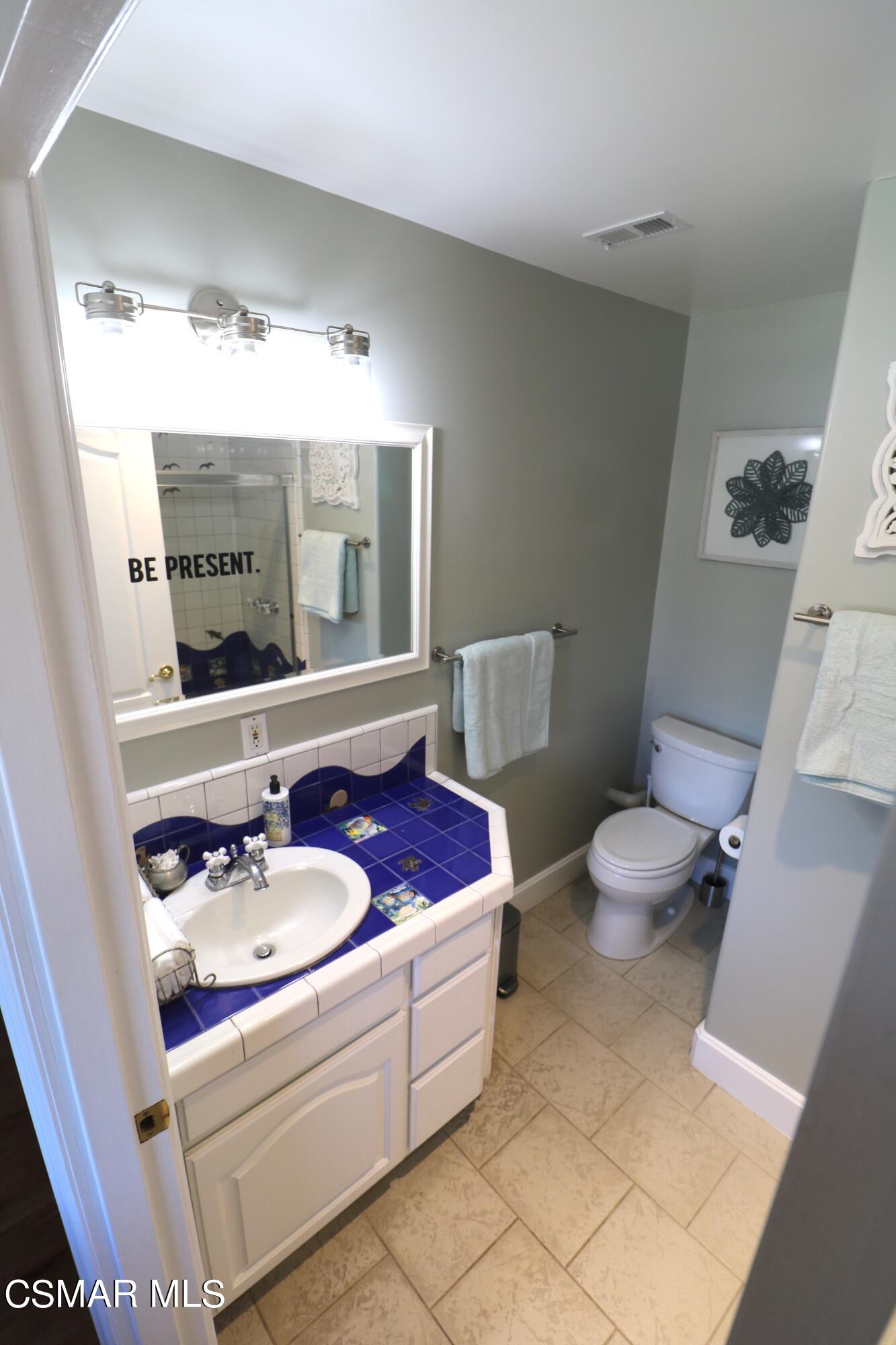 4608 Apricot Road Simi Valley, CA 93063 - Photo 26 of 37 a bathroom with a sink a toilet and mirror