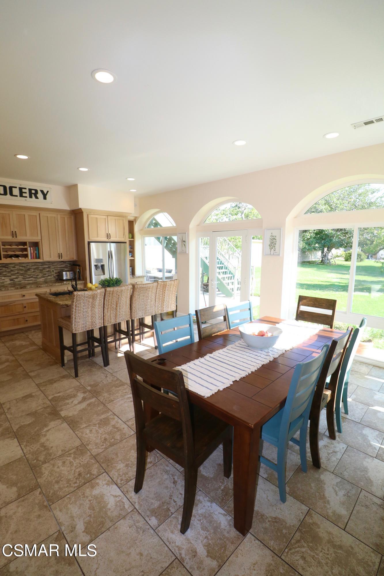 4608 Apricot Road Simi Valley, CA 93063 - Photo 10 of 37 a dining room with a wooden table and chairs