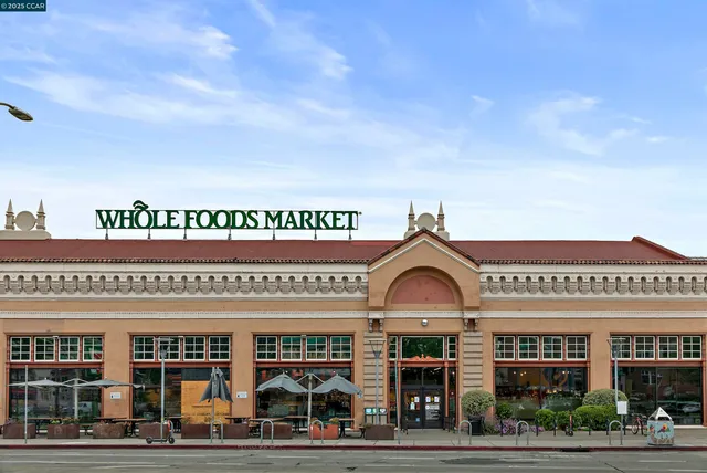 a front view of building with a garden