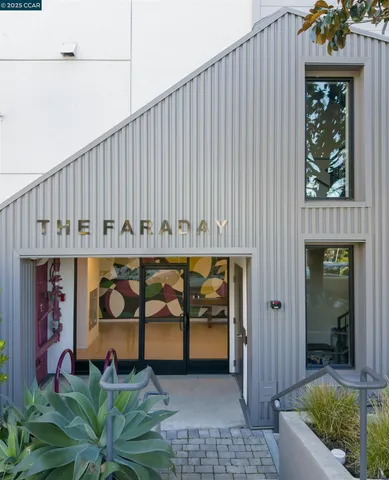 a front view of a house with entryway and outdoor seating