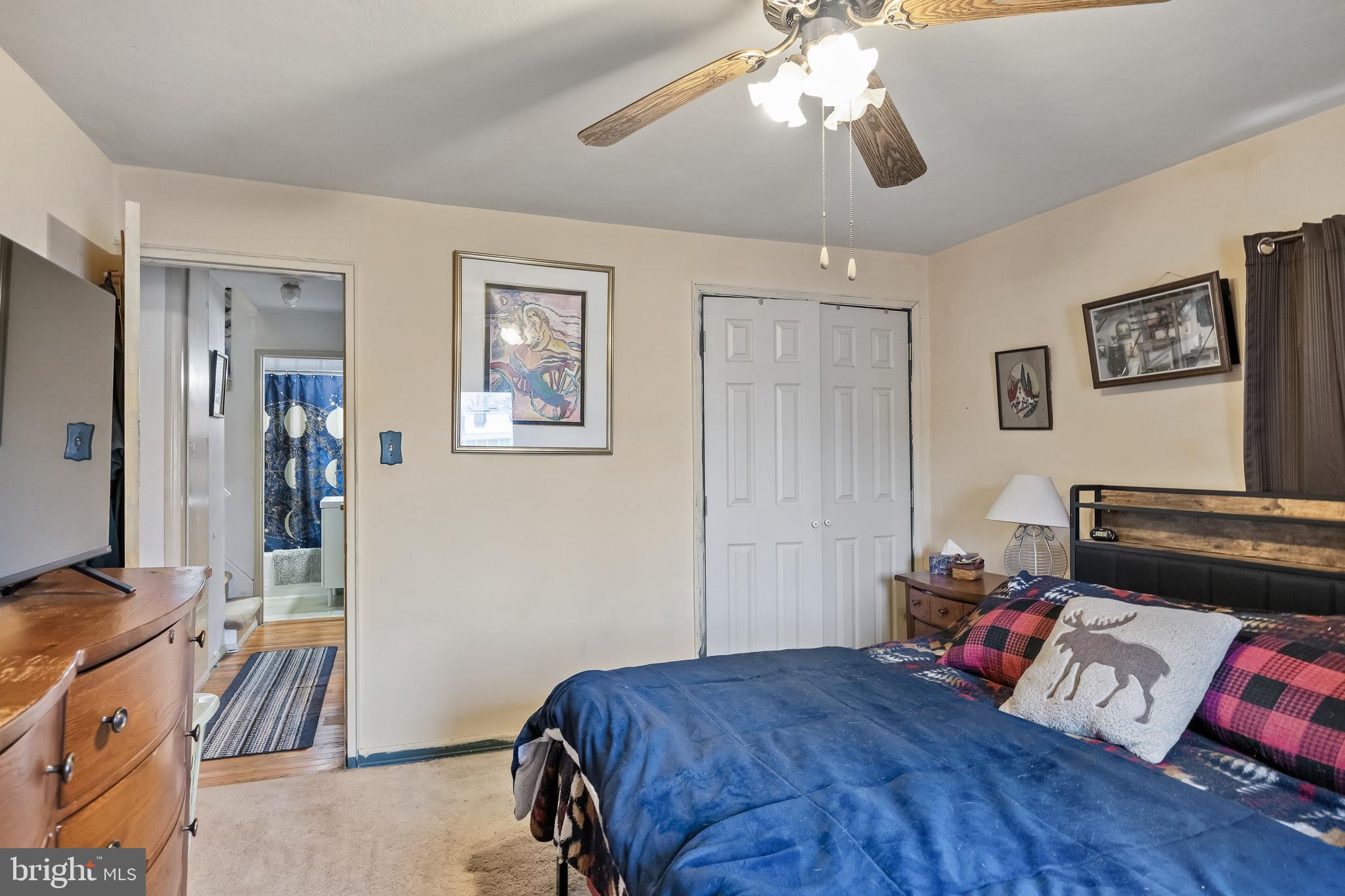 710 Cooper Street Florence, NJ 08518 - Photo 15 of 27 a bedroom with bed and a chandelier