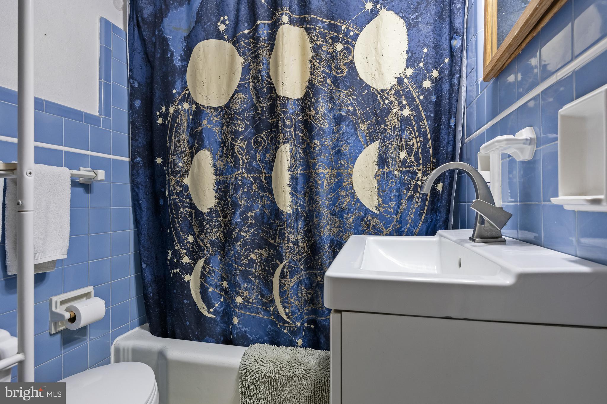 710 Cooper Street Florence, NJ 08518 - Photo 16 of 27 a bathroom with a toilet sink and mirror