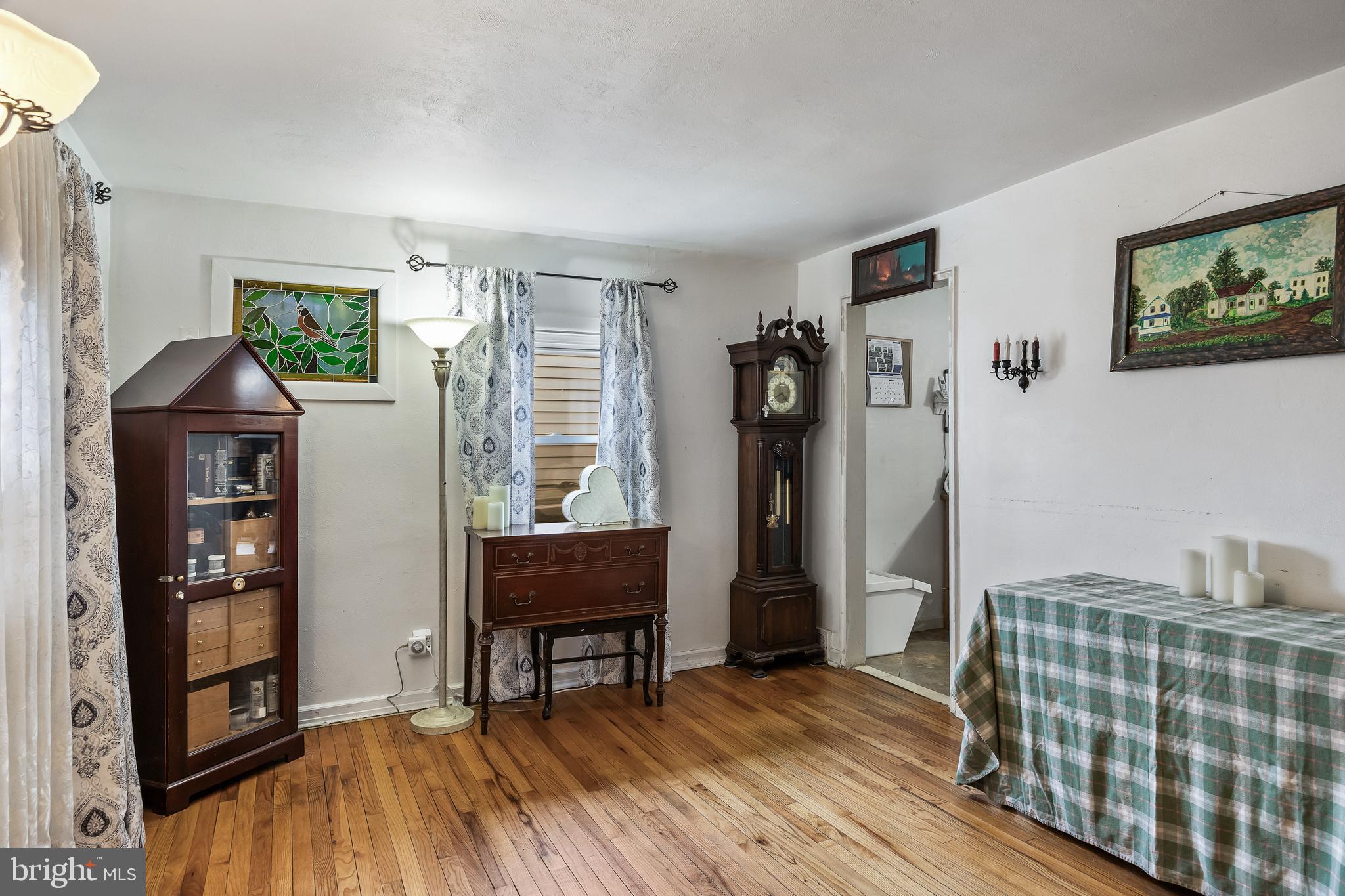 710 Cooper Street Florence, NJ 08518 - Photo 2 of 27 a bedroom with furniture and a window