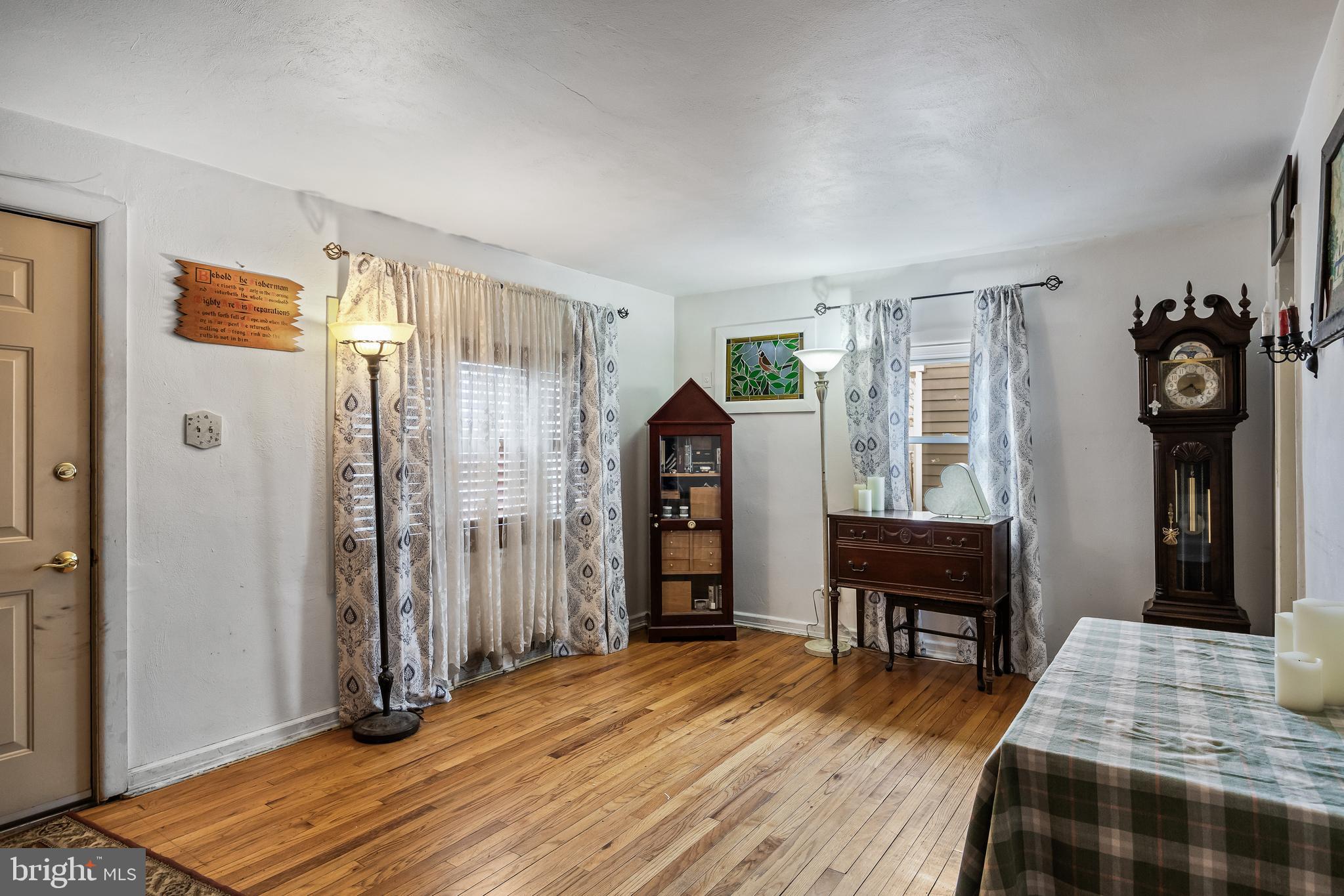 710 Cooper Street Florence, NJ 08518 - Photo 3 of 27 a bedroom with a bed and wooden floor