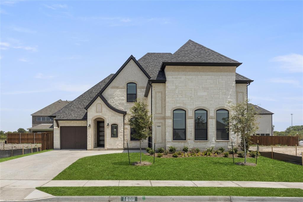 1808 Sapphire Road Rockwall, TX 75087 - Photo 1 of 1 a front view of a house with a yard