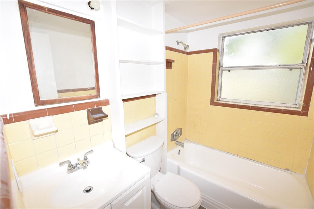 104 West Lancaster Road Orlando, FL 32809 - Photo 15 of 24 a bathroom with a sink and a bathtub