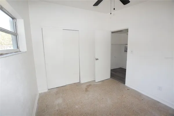 a view of an empty room with a window