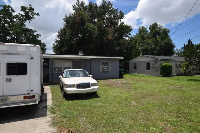 a house view with a tub and trees