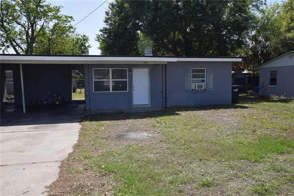 a house with trees in the background