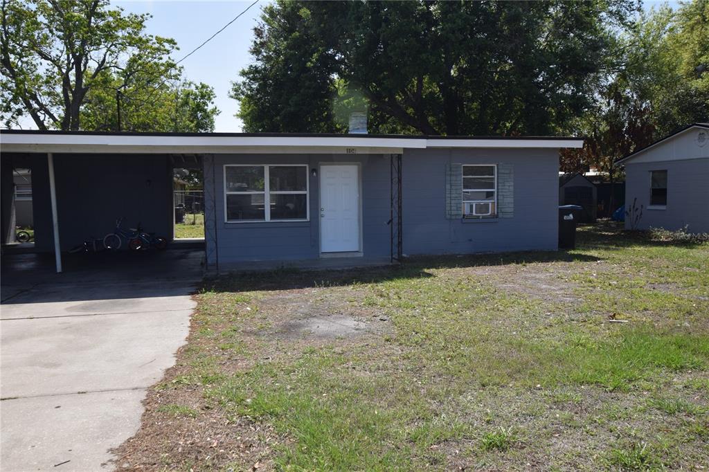 104 West Lancaster Road Orlando, FL 32809 - Photo 2 of 24 a house with trees in the background