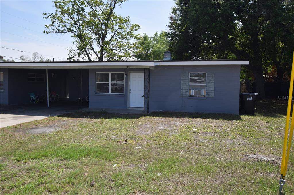 104 West Lancaster Road Orlando, FL 32809 - Photo 4 of 24 front view of a house and a yard