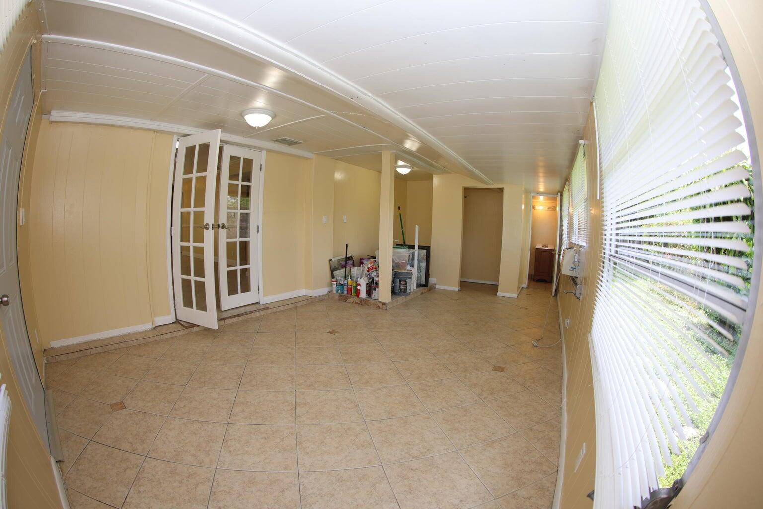 181 East Copans Road Pompano Beach, FL 33064 - Photo 11 of 11 a view of a livingroom with furniture and windows