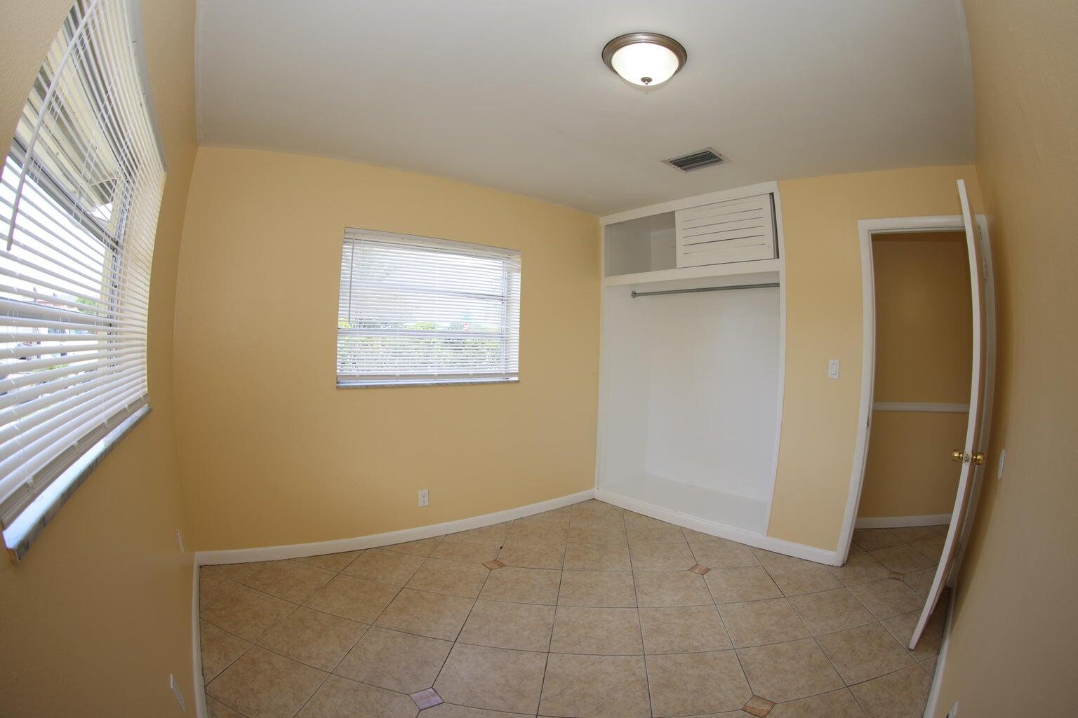 181 East Copans Road Pompano Beach, FL 33064 - Photo 9 of 11 an empty room with windows