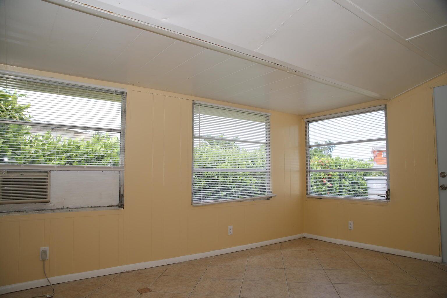 181 East Copans Road Pompano Beach, FL 33064 - Photo 10 of 11 a view of an empty room with a window