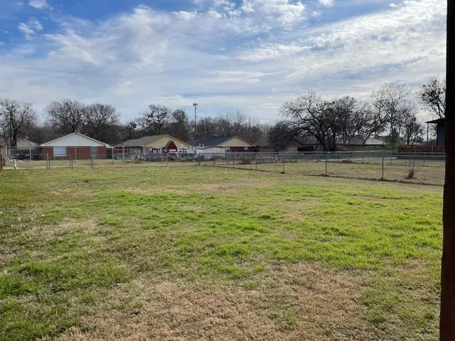 a view of a lake with houses in the back