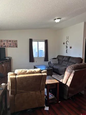 a living room with a couch and a window